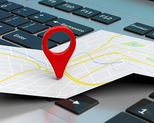 3d render of a red pin marking a unfolded map over a computer keyboard representing the targeted expansion of the beauty and wellness franchise